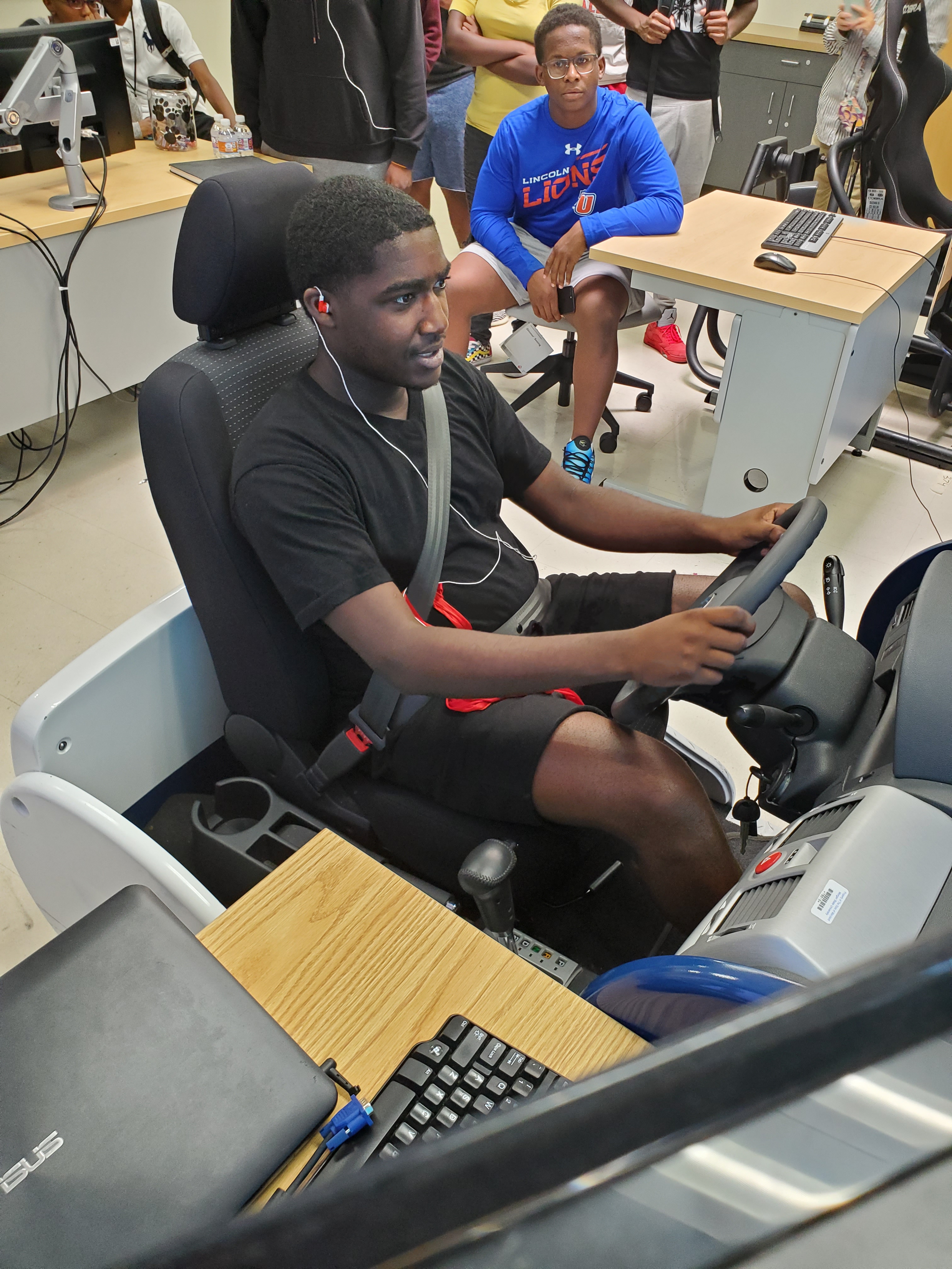 student on driving simulator