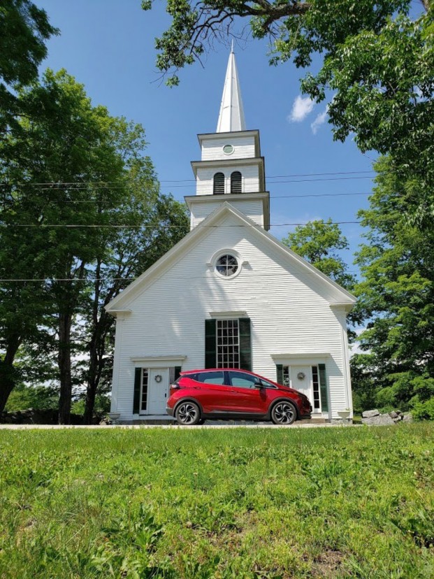chevy bolt by a church