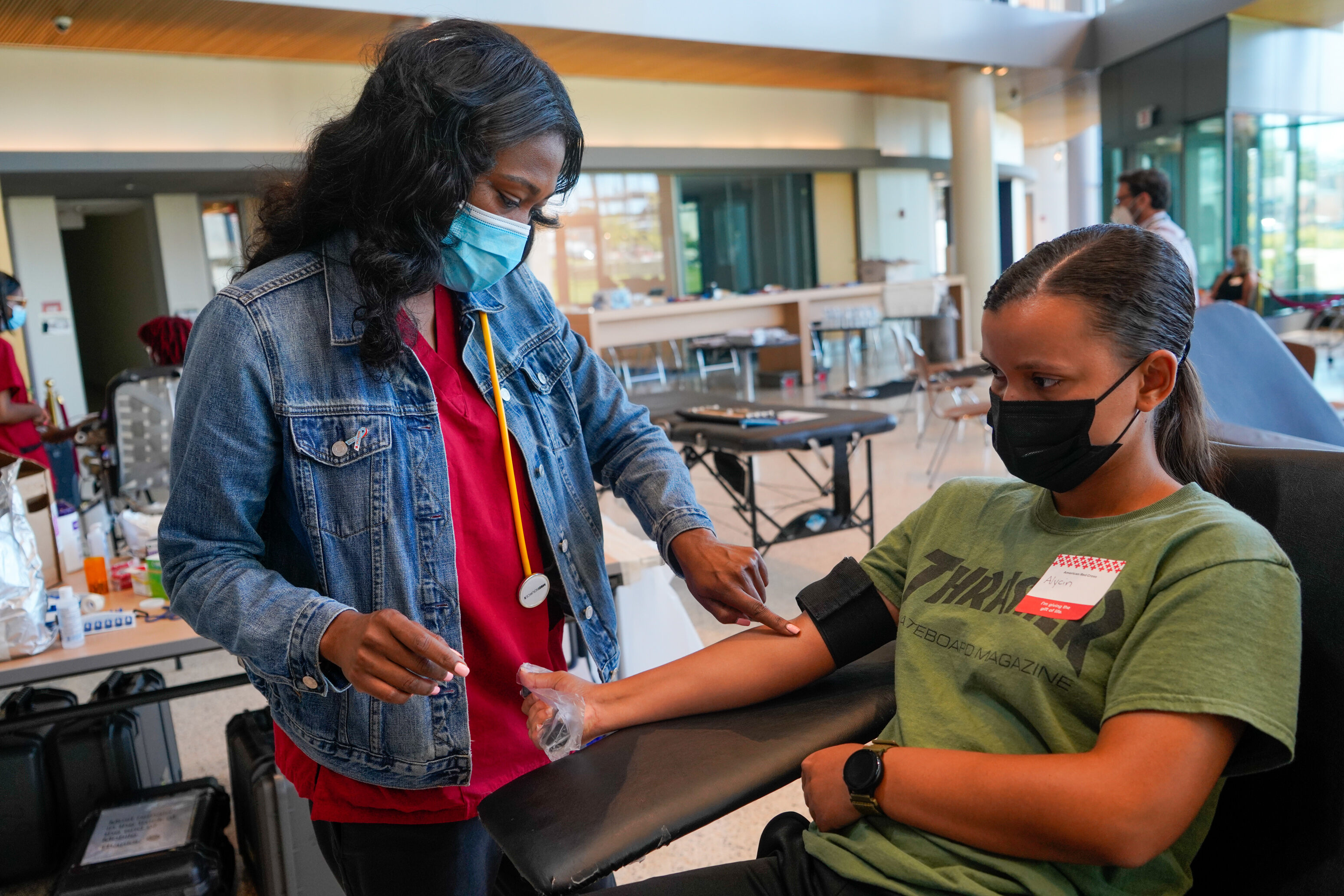 Nurse taking blood from a Morgan Student