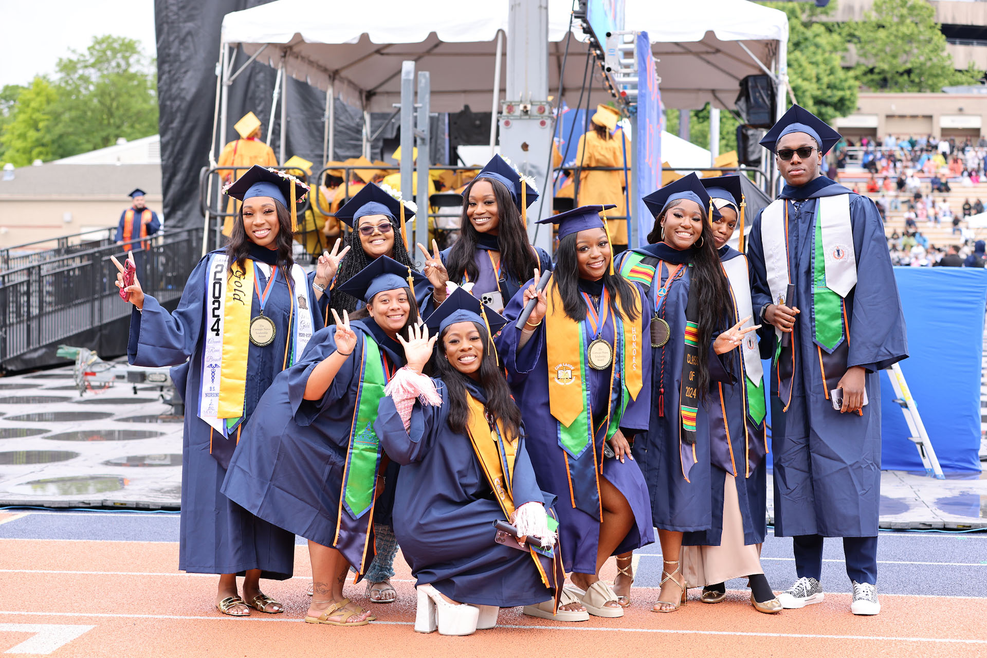 9 graduating students smiling