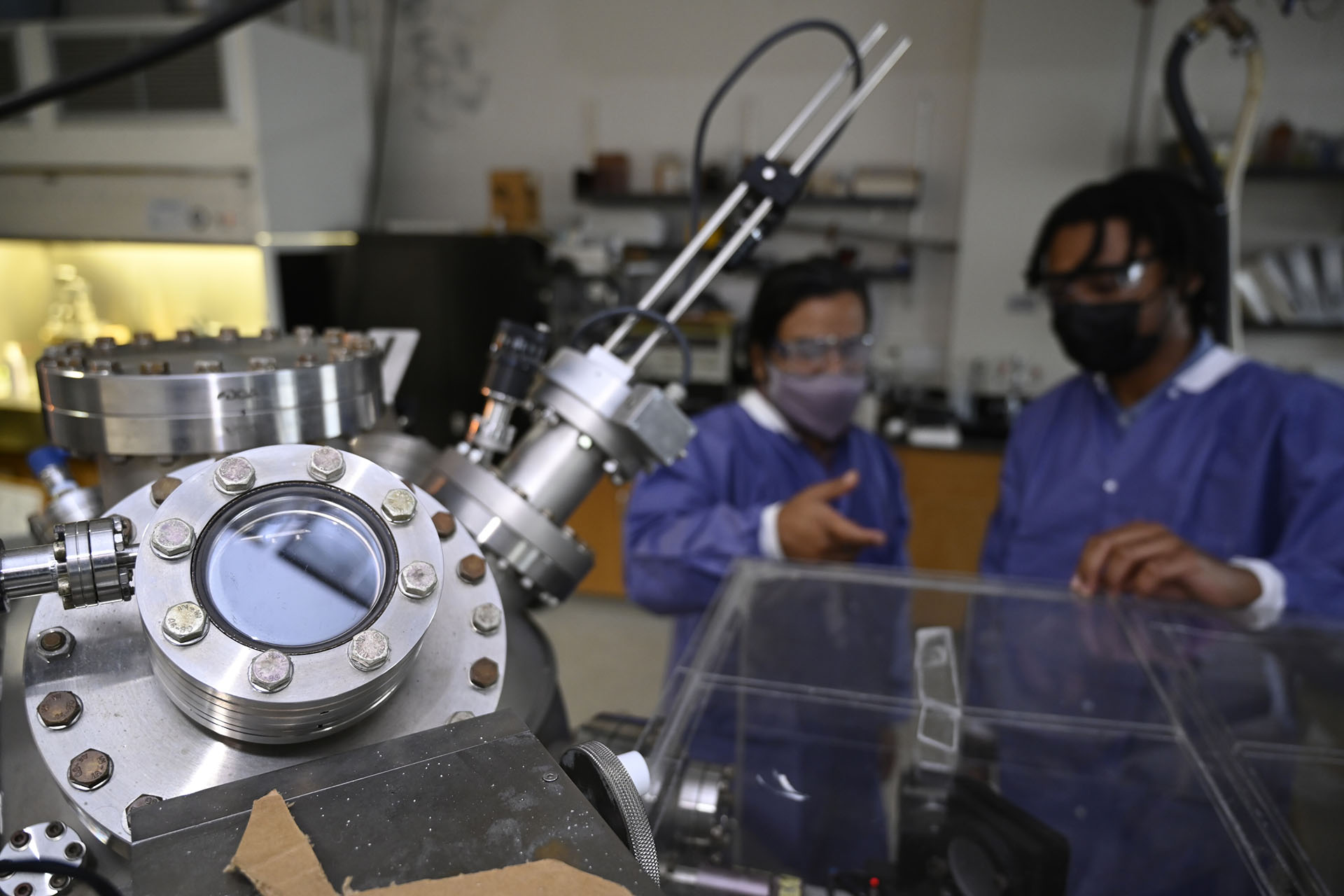 student and faculty member in a research lab